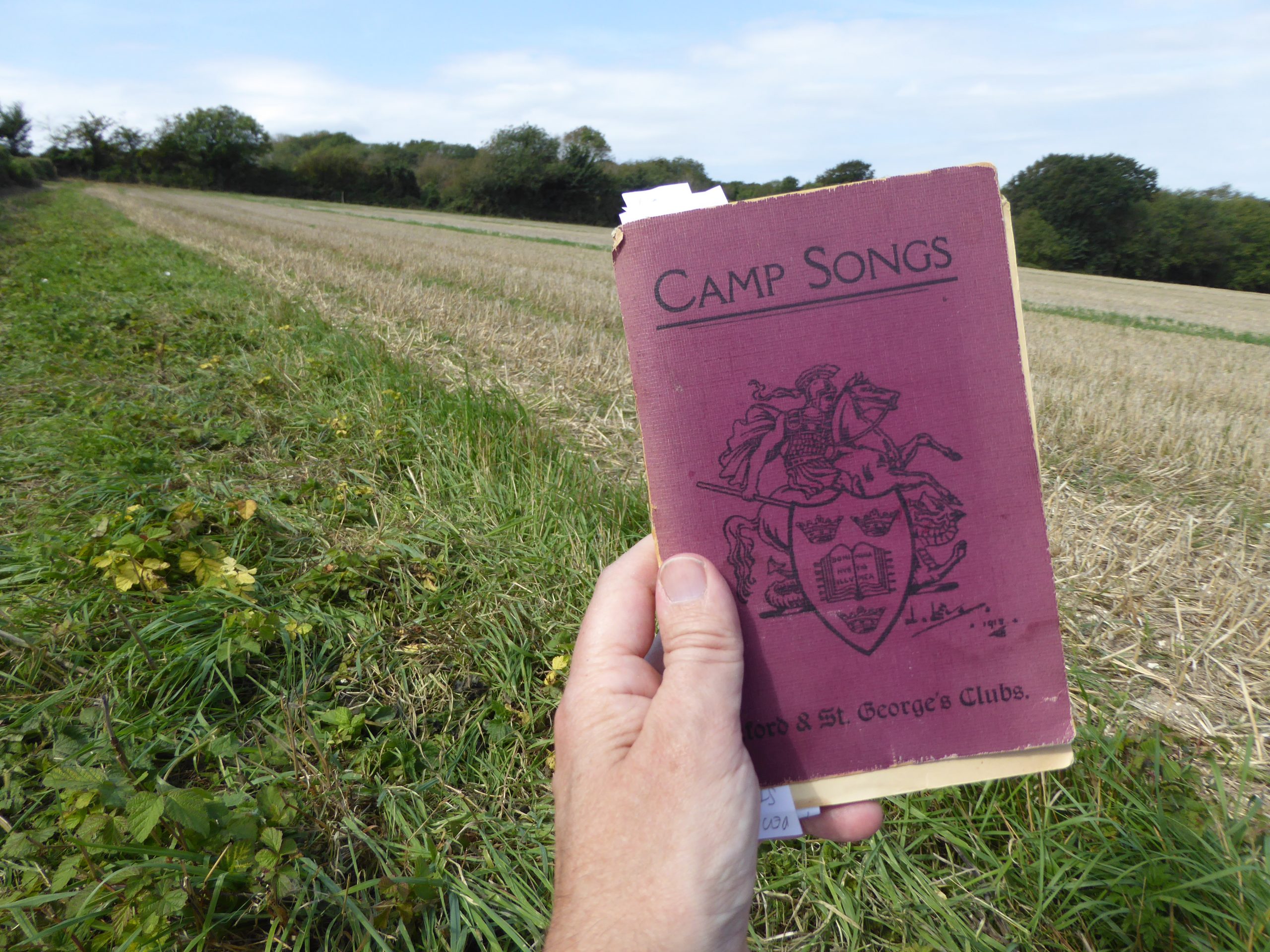 Camp song book in Highdown field, summer 2020 by Hamish MacGillivray